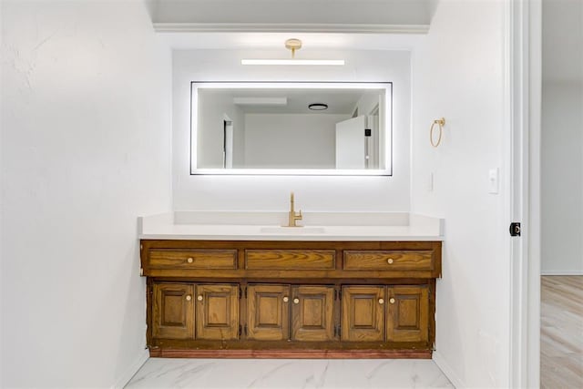900 Woodbury Dr, Edmond, OK 73034 - bathroom with vanity and marble look tiles