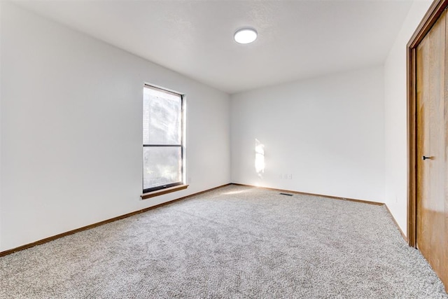 900 Woodbury Dr, Edmond, OK 73034 - unfurnished room featuring carpet floors