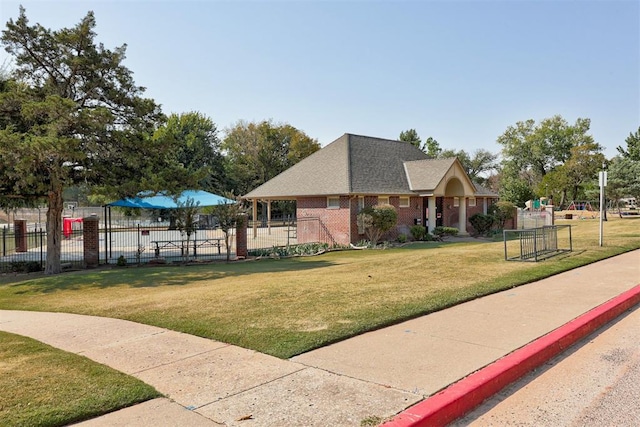 view of home's community with a yard