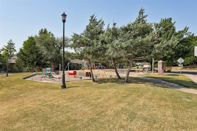 view of playground featuring a lawn