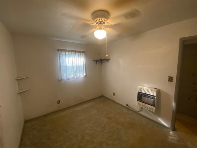 unfurnished room featuring heating unit, ceiling fan, and carpet