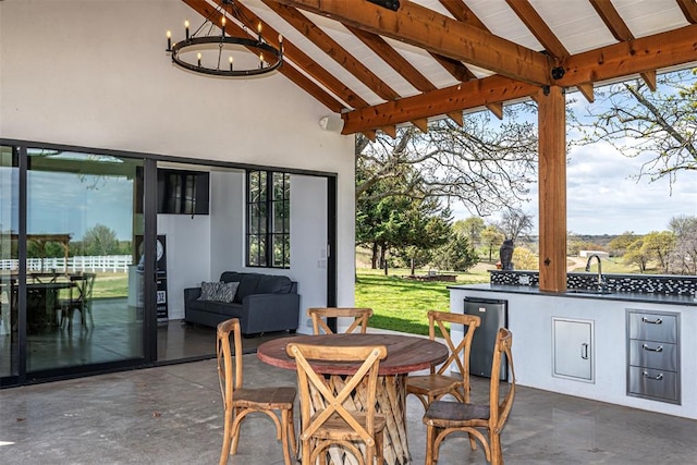 view of patio featuring a gazebo, outdoor lounge area, sink, and exterior kitchen