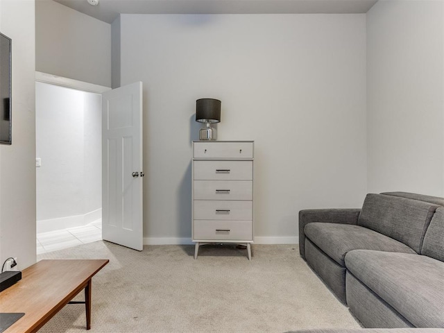 sitting room featuring light colored carpet