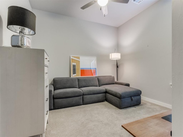 living room featuring ceiling fan and carpet floors