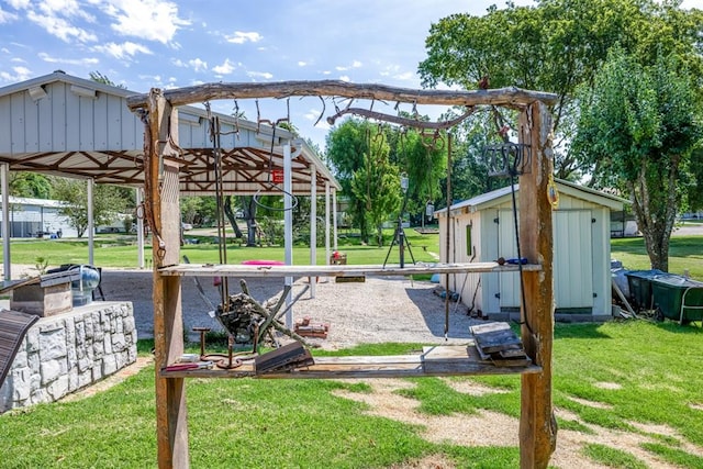 view of property's community with a lawn and a storage unit