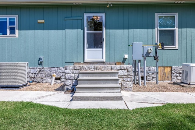 entrance to property with central AC unit