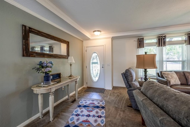 entrance foyer with carpet flooring and crown molding