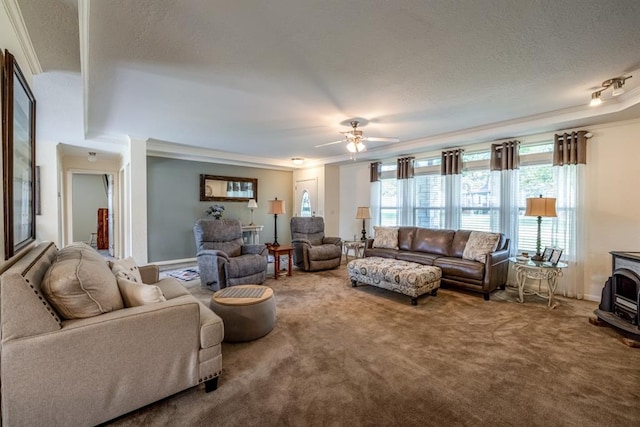 living room with carpet flooring, a wood stove, and ornamental molding