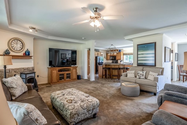 living room with carpet flooring, ceiling fan, and ornamental molding