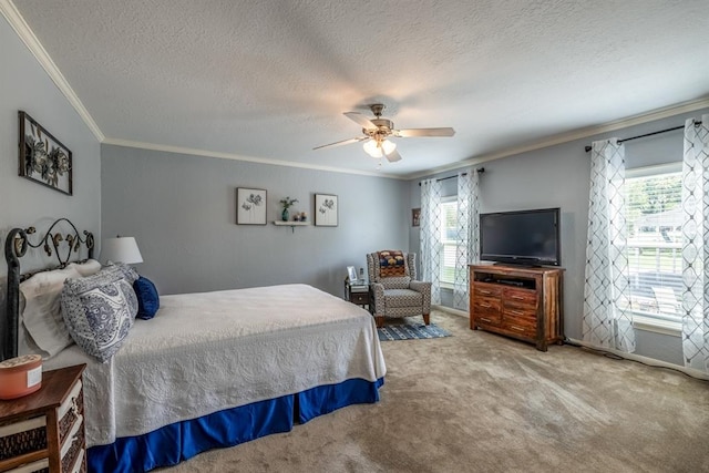 bedroom featuring carpet, a textured ceiling, ceiling fan, and ornamental molding