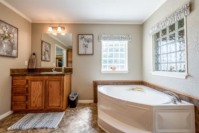 bathroom with tile patterned floors, vanity, crown molding, and a bath