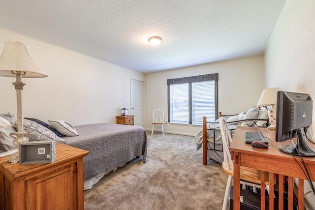 bedroom featuring carpet flooring and a textured ceiling