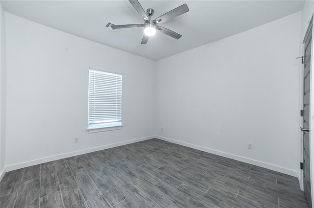 unfurnished room featuring ceiling fan and dark hardwood / wood-style floors