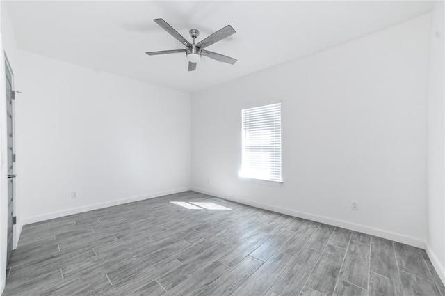 empty room featuring wood-type flooring and ceiling fan