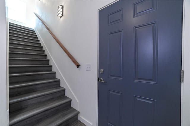 foyer entrance with dark hardwood / wood-style flooring