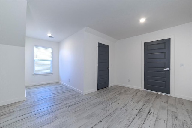 bonus room with light hardwood / wood-style floors