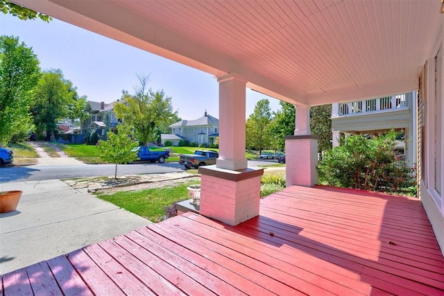 wooden terrace with a porch