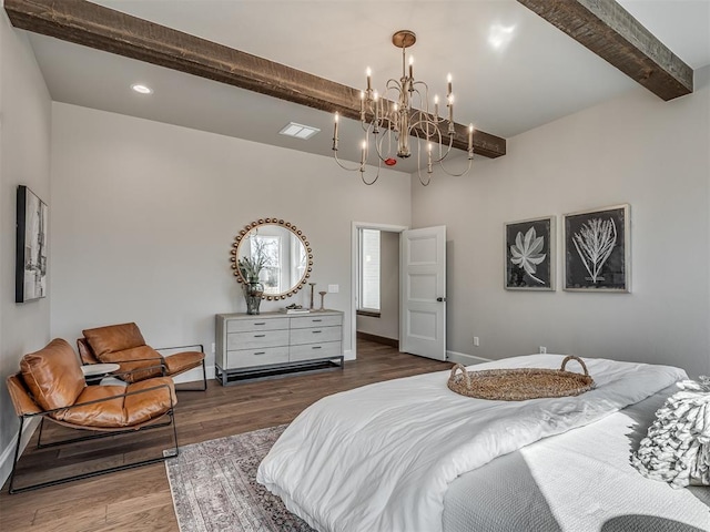 bedroom with beamed ceiling, recessed lighting, wood finished floors, and baseboards