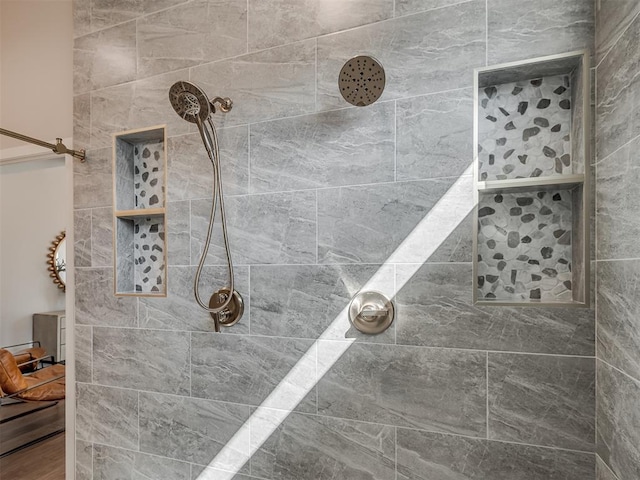 bathroom with tiled shower