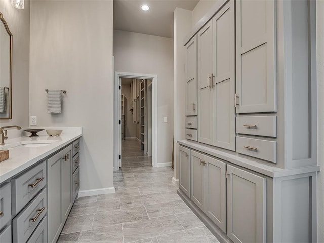 full bathroom with recessed lighting, baseboards, and vanity