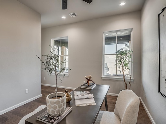 office space featuring recessed lighting, plenty of natural light, wood finished floors, and visible vents