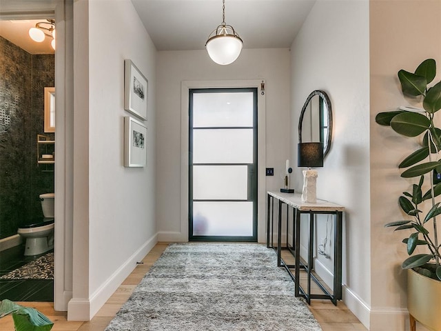 entryway with light hardwood / wood-style flooring