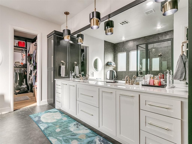 bathroom featuring vanity, walk in shower, and concrete floors