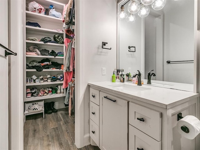 bathroom featuring hardwood / wood-style flooring and vanity