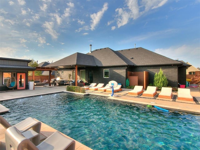 view of swimming pool with a patio area