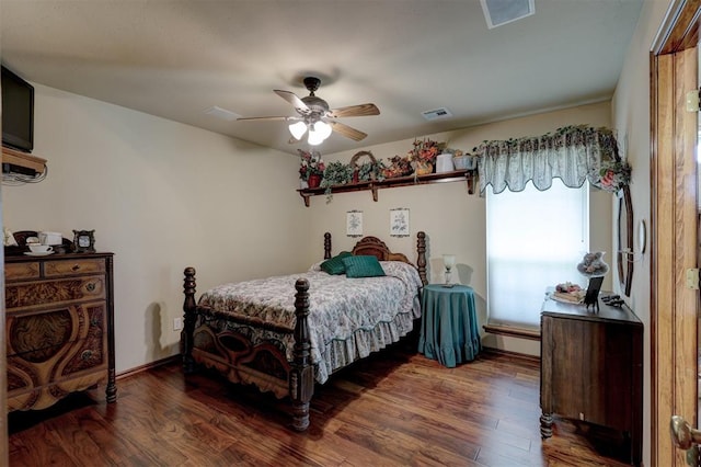 bedroom featuring ceiling fan, dark wood-type flooring, and a baseboard radiator