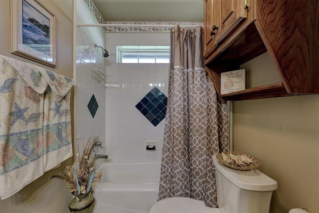 bathroom with toilet and shower / bath combo with shower curtain