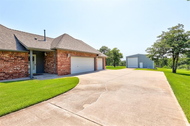 ranch-style house with a front yard and a garage