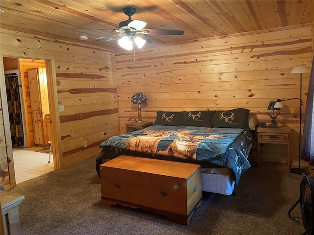 bedroom featuring light carpet, ceiling fan, wooden ceiling, and wood walls