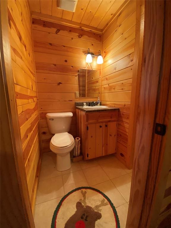 bathroom featuring wood walls, tile patterned flooring, vanity, and wood ceiling