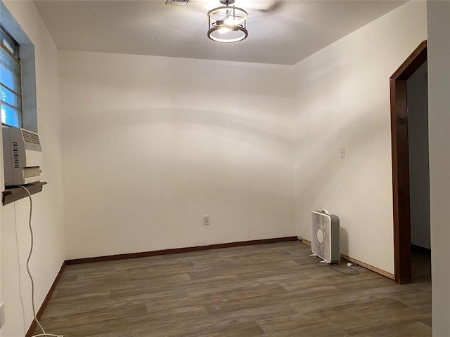 spare room featuring dark hardwood / wood-style floors