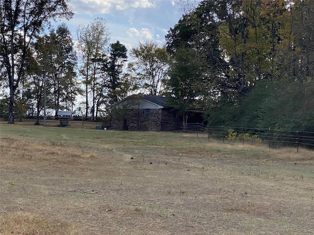 view of yard with a rural view