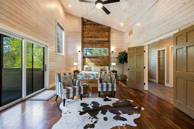 bedroom featuring access to exterior, dark hardwood / wood-style flooring, wooden walls, high vaulted ceiling, and wooden ceiling