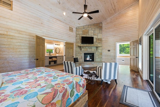 bedroom with high vaulted ceiling, ceiling fan, dark hardwood / wood-style floors, a fireplace, and wood ceiling