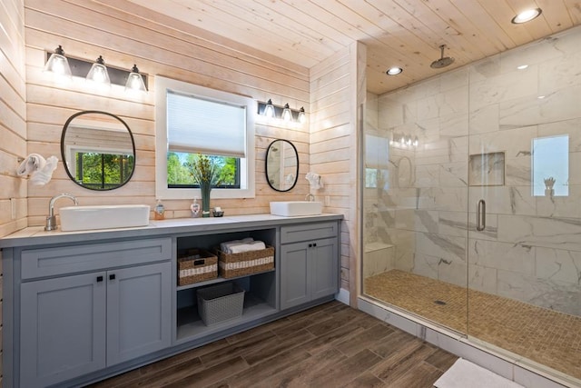 bathroom with wood-type flooring, vanity, an enclosed shower, and wood ceiling