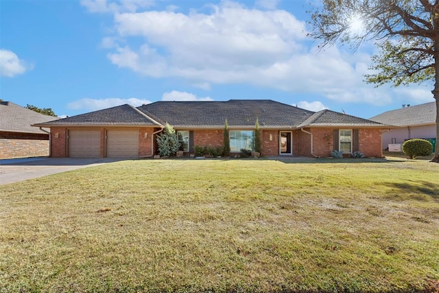 single story home featuring a garage and a front yard