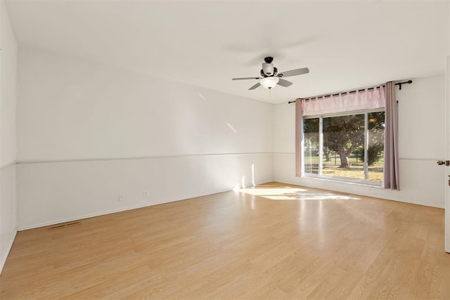 unfurnished room featuring ceiling fan and light hardwood / wood-style flooring