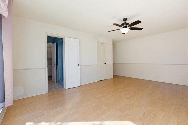 unfurnished room featuring ceiling fan and light hardwood / wood-style flooring