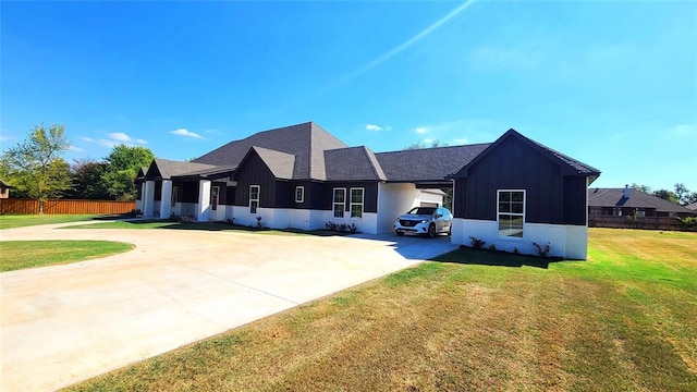 view of front facade with a carport and a front yard