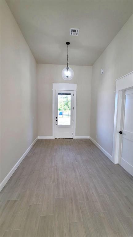 1308 W Harvard Way, Mustang, OK 73064 - unfurnished dining area featuring light wood-style floors and baseboards