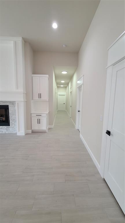 corridor featuring light hardwood / wood-style floors