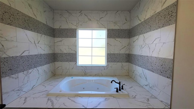 bathroom featuring tiled bath