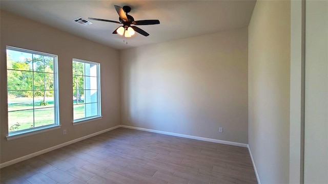 unfurnished room with ceiling fan and light hardwood / wood-style floors