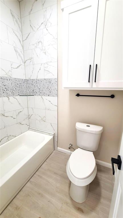 1308 W Harvard Way, Mustang, OK 73064 - bathroom with baseboards, toilet, and shower / bath combination