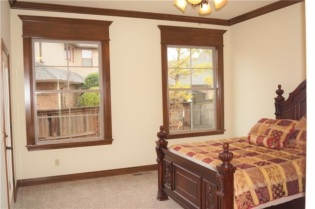 carpeted bedroom featuring ornamental molding