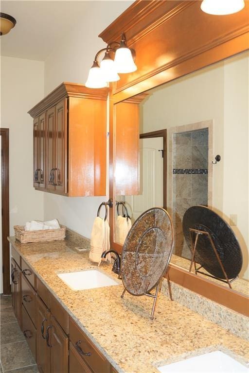 bathroom featuring tile patterned flooring and vanity